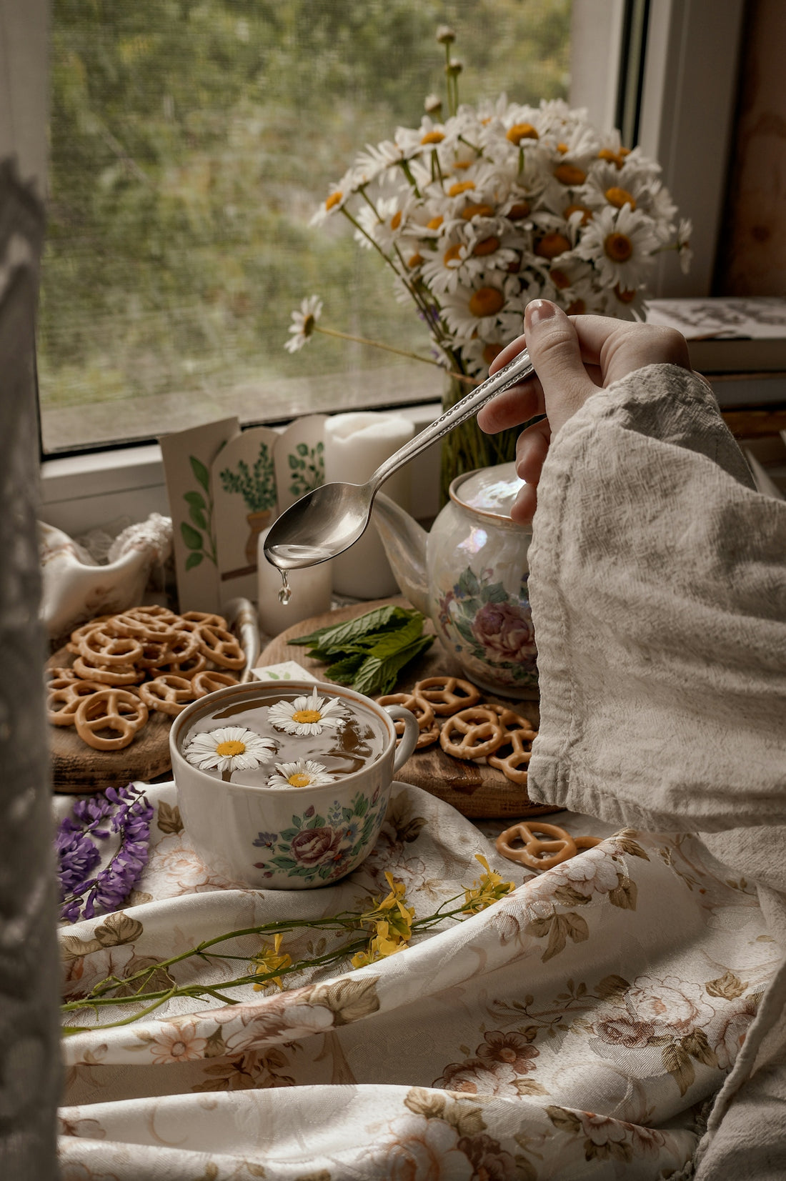 person holding silver spoon with brown and white cereals