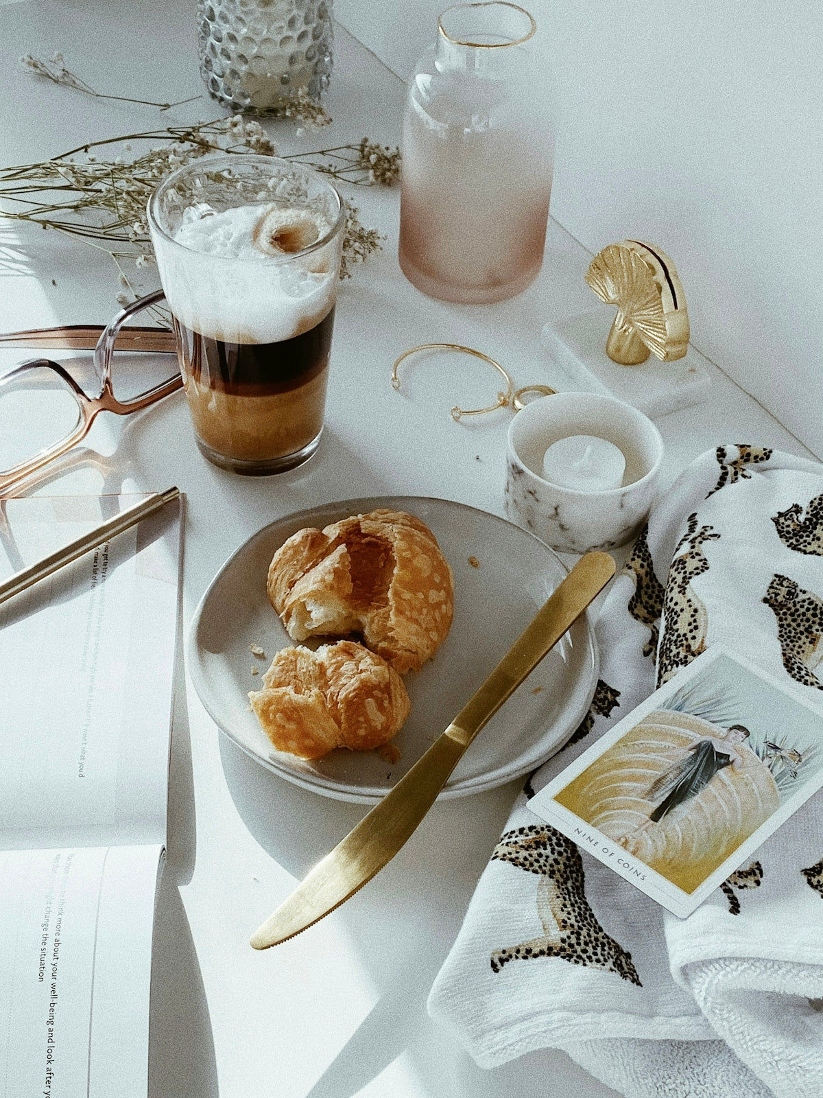 bread on white ceramic plate beside clear drinking glass