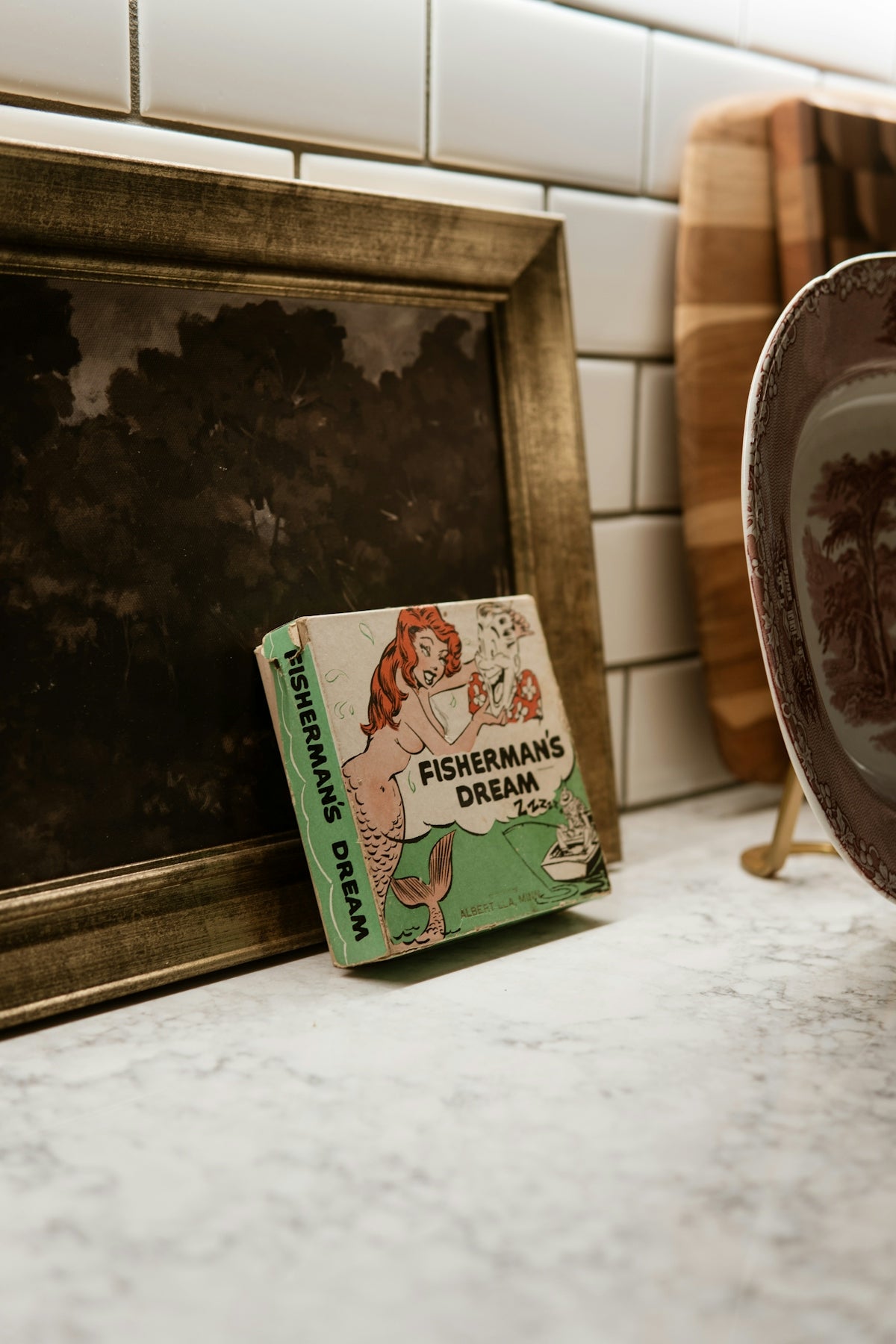 A picture frame sitting on top of a counter
