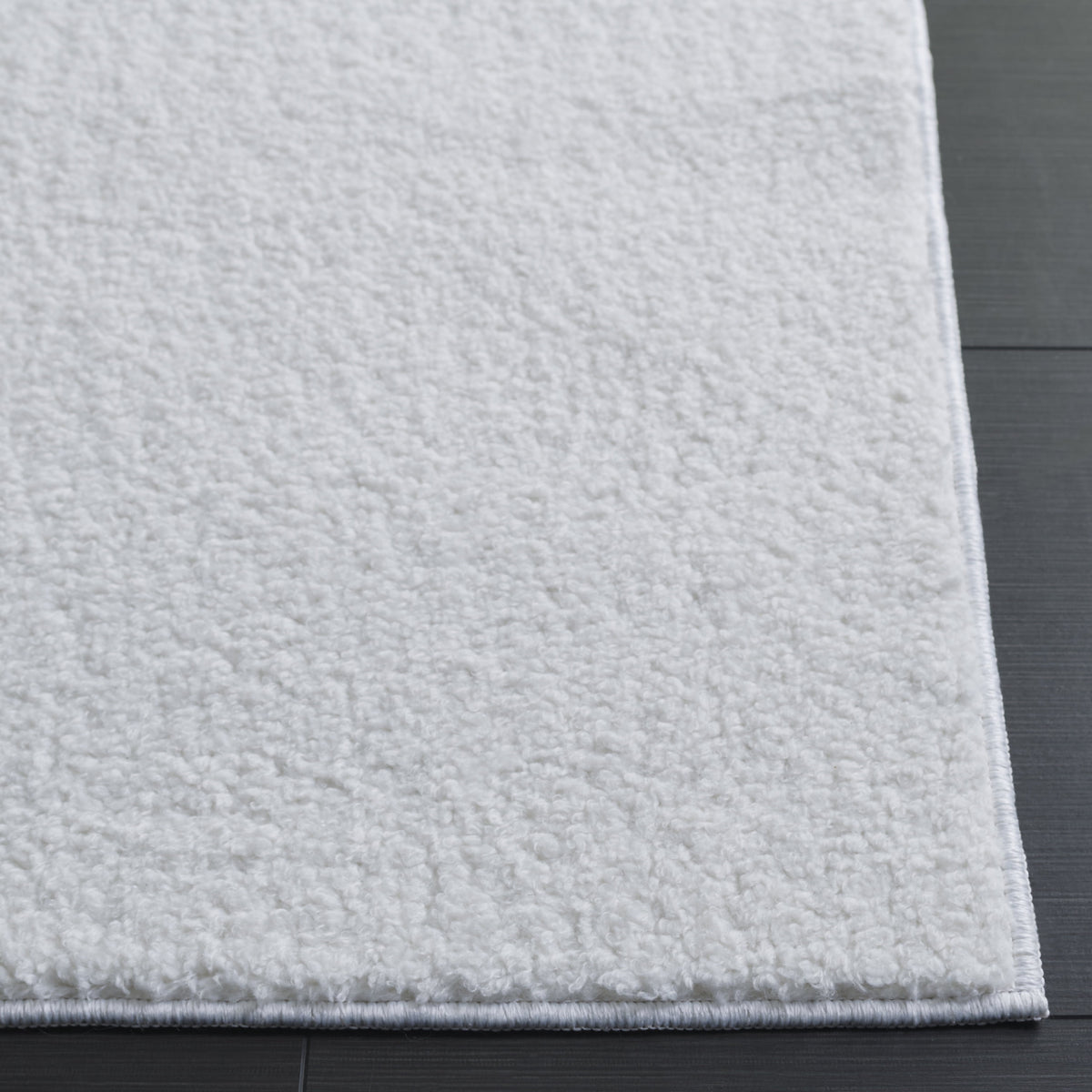 Elladera SAFAVIEH Boucle Lauressa Solid Machine Washable Area Rug, Ivory, 5' x 7'